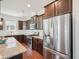 Kitchen features stainless steel appliances, granite countertops, a gas range, and ample cabinet space at 3901 Yates Mill Trl, Raleigh, NC 27606