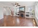 Spacious living room featuring a fireplace, hardwood floors, and built-in shelving at 3901 Yates Mill Trl, Raleigh, NC 27606