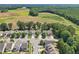 Aerial community shot of a suburban neighborhood surrounded by trees and farmland at 3901 Yates Mill Trl, Raleigh, NC 27606