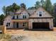 New construction home with a two-car garage and classic design at 392 Abingdon Farms Dr, Selma, NC 27576