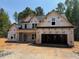 New construction home with a two-car garage and classic design at 392 Abingdon Farms Dr, Selma, NC 27576