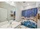 Well-lit bathroom featuring modern fixtures, a decorative shower curtain and vanity at 40 Two Creeks Loop, Chapel Hill, NC 27517