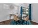 Bright dining room featuring a glass table, elegant decor and natural light with views to a patio at 40 Two Creeks Loop, Chapel Hill, NC 27517