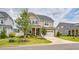 Charming two-story home featuring a stone and siding exterior, well-manicured lawn, and an attached two-car garage at 40 Two Creeks Loop, Chapel Hill, NC 27517