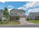 Charming two-story home with a two-car garage and a beautifully landscaped front yard at 40 Two Creeks Loop, Chapel Hill, NC 27517
