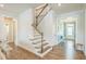 Bright foyer with hardwood floors and staircase leading to the upper level of the home at 40 Two Creeks Loop, Chapel Hill, NC 27517