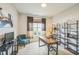 Functional home office with a desk, shelves, and a comfortable chair overlooking the backyard at 40 Two Creeks Loop, Chapel Hill, NC 27517