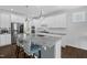 Modern kitchen features a granite island, stainless appliances, and white cabinets at 40 Two Creeks Loop, Chapel Hill, NC 27517