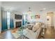 Cozy living room with a fireplace, plush seating, and ample natural light at 40 Two Creeks Loop, Chapel Hill, NC 27517