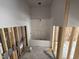 Bathroom under construction showcasing a new tub shower, exposed framing, and plumbing fixtures at 4024 N Nc 581 Hwy, Kenly, NC 27542