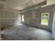 Under-construction bedroom with sheetrocked walls, two windows, and ceiling detail at 4024 N Nc 581 Hwy, Kenly, NC 27542