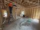 Unfinished living room shows layout including fireplace and bathroom location at 4024 N Nc 581 Hwy, Kenly, NC 27542