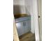 A grey shaker-style cabinet under construction with black hardware, showcasing sleek, modern design at 4035 King Charles Rd, Durham, NC 27707