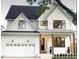 Beautiful modern farmhouse exterior with white siding, black trim, and a welcoming front porch at 4035 King Charles Rd, Durham, NC 27707