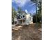 New construction home featuring modern farmhouse style with attached garage in wooded area at 4035 King Charles Rd, Durham, NC 27707