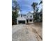 New construction home featuring modern farmhouse style with attached garage in wooded area at 4035 King Charles Rd, Durham, NC 27707