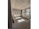 Spacious living room with natural light streaming through windows and doors, leading to an outdoor area at 4035 King Charles Rd, Durham, NC 27707