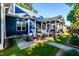 Secluded backyard with outdoor seating, a grill, and lush green lawn at 405 Culvert St, Apex, NC 27502