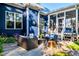Inviting patio area featuring outdoor seating, plants and a stainless steel grill at 405 Culvert St, Apex, NC 27502