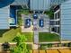 Overhead view of backyard patio featuring blue cushioned seating and manicured landscaping at 405 Culvert St, Apex, NC 27502