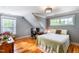 Cozy bedroom with hardwood floors, a desk area, and large window, creating a serene atmosphere at 405 Culvert St, Apex, NC 27502