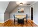 Charming dining area features a drop-leaf table and chairs, illuminated by modern light fixture at 405 Culvert St, Apex, NC 27502
