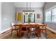 A bright dining room area featuring a wooden table with seating and light fixture hanging overhead at 405 Culvert St, Apex, NC 27502