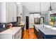 Modern kitchen with white cabinets, stainless steel appliances, hardwood floors and a bold backsplash at 405 Culvert St, Apex, NC 27502