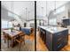 A bright eat-in kitchen with stainless steel appliances, quartz countertops, island, and a dining table with seating at 405 Culvert St, Apex, NC 27502