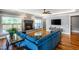 Inviting living room with hardwood floors, a cozy fireplace, and a comfortable blue sectional sofa at 405 Culvert St, Apex, NC 27502