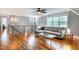 Comfortable living room with hardwood floors, sleeper sofa, and stylish table; filled with natural light at 405 Culvert St, Apex, NC 27502