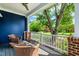 Outdoor porch featuring wicker chairs, a table and a great view at 405 Culvert St, Apex, NC 27502
