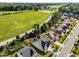 An aerial view of a residential neighborhood next to a large field and tree line at 427 Cedar Pond Ct, Knightdale, NC 27545