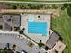 Aerial view of community pool, clubhouse, parking, playground and landscaping at 427 Cedar Pond Ct, Knightdale, NC 27545