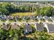 Aerial view of a home with screened in back porch surrounded by a neatly landscaped neighborhood at 427 Cedar Pond Ct, Knightdale, NC 27545