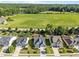 An aerial view of a residential neighborhood next to a large field and tree line at 427 Cedar Pond Ct, Knightdale, NC 27545