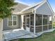 A screened-in back porch with concrete patio and a view to the grassy backyard at 427 Cedar Pond Ct, Knightdale, NC 27545