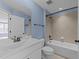 Bright bathroom with a bathtub shower, sleek white vanity, and modern fixtures for everyday elegance at 427 Cedar Pond Ct, Knightdale, NC 27545