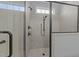 Modern tiled walk-in shower with glass enclosure and dual shower heads, offering a spa-like experience at 427 Cedar Pond Ct, Knightdale, NC 27545
