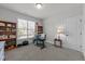 Well-lit home office space with a large window, desk, and shelving at 427 Cedar Pond Ct, Knightdale, NC 27545