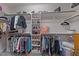 Spacious walk-in closet with custom shelving and hanging rods for organized storage at 427 Cedar Pond Ct, Knightdale, NC 27545