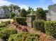 A well-maintained neighborhood entrance with a decorative stone sign and lush landscaping at 427 Cedar Pond Ct, Knightdale, NC 27545