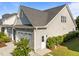Beautiful exterior showing the side of a home with stone accents and a two-car garage at 427 Cedar Pond Ct, Knightdale, NC 27545
