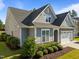 Gray shake shingle home with landscaped garden and a two-car garage at 427 Cedar Pond Ct, Knightdale, NC 27545