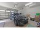 Well-lit two car garage showcasing ample parking space and storage at 427 Cedar Pond Ct, Knightdale, NC 27545