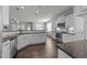 Modern kitchen with stainless steel appliances, white cabinetry, and a subway tile backsplash with bar seating at 427 Cedar Pond Ct, Knightdale, NC 27545