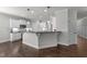 Bright and modern kitchen featuring white cabinets, stainless steel appliances, and a bar-style counter top at 427 Cedar Pond Ct, Knightdale, NC 27545