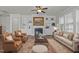 Inviting living room featuring built-in shelving, a cozy fireplace, and comfortable seating at 427 Cedar Pond Ct, Knightdale, NC 27545