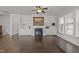 Spacious living room featuring built-in shelving, a cozy fireplace, and hardwood floors at 427 Cedar Pond Ct, Knightdale, NC 27545
