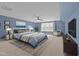 Serene primary bedroom featuring a plush bed, stylish decor, and ample natural light at 427 Cedar Pond Ct, Knightdale, NC 27545